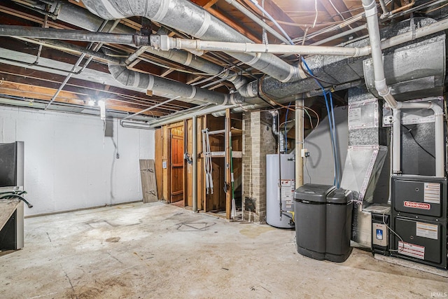 basement featuring heating unit and water heater