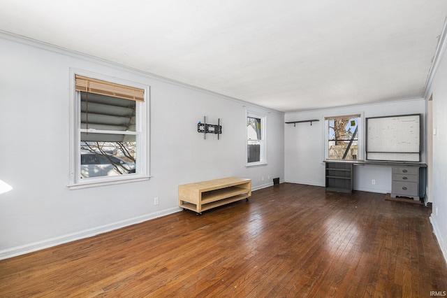 spare room with crown molding and dark hardwood / wood-style floors