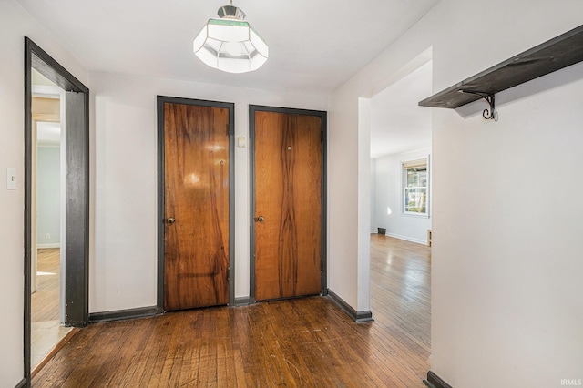 hall featuring dark wood-type flooring