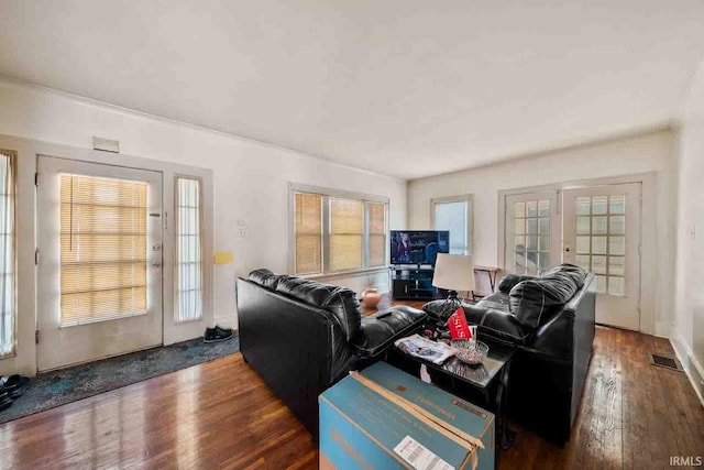 living room featuring french doors and dark hardwood / wood-style flooring