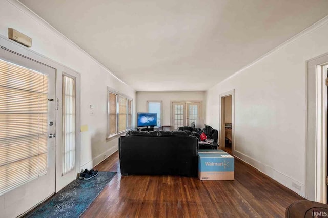 living room with french doors, dark hardwood / wood-style floors, and ornamental molding