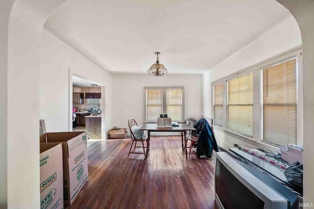 interior space with dark hardwood / wood-style floors and an inviting chandelier