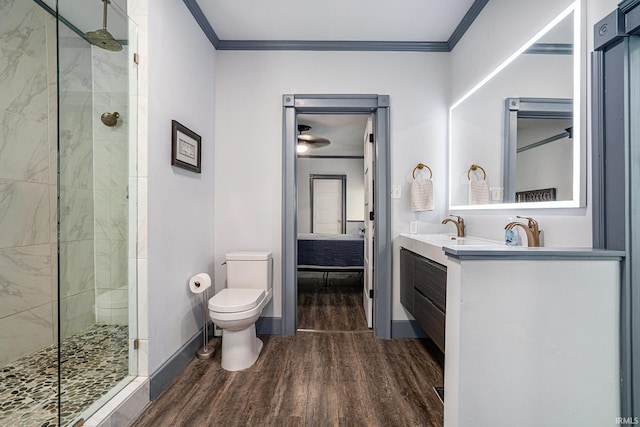 bathroom featuring toilet, vanity, ornamental molding, and hardwood / wood-style flooring