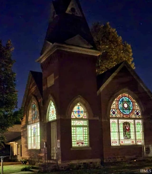 view of property exterior at night