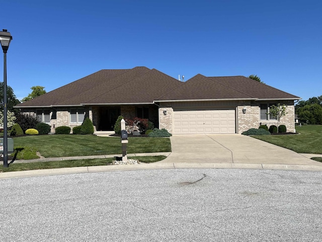 view of front facade with a front lawn and a garage