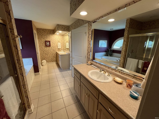 bathroom with independent shower and bath, tile patterned flooring, and vanity