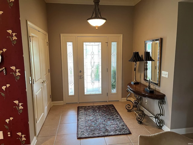 foyer entrance with light tile patterned flooring