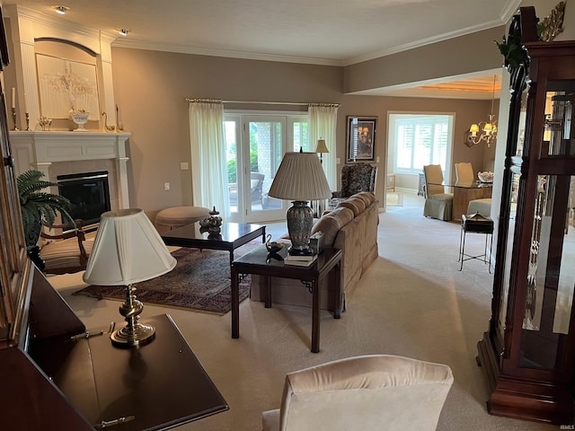 carpeted living room with an inviting chandelier and crown molding