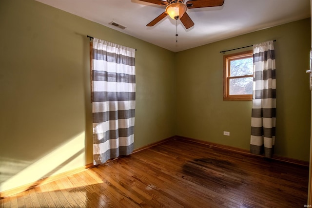 unfurnished room featuring ceiling fan and hardwood / wood-style flooring