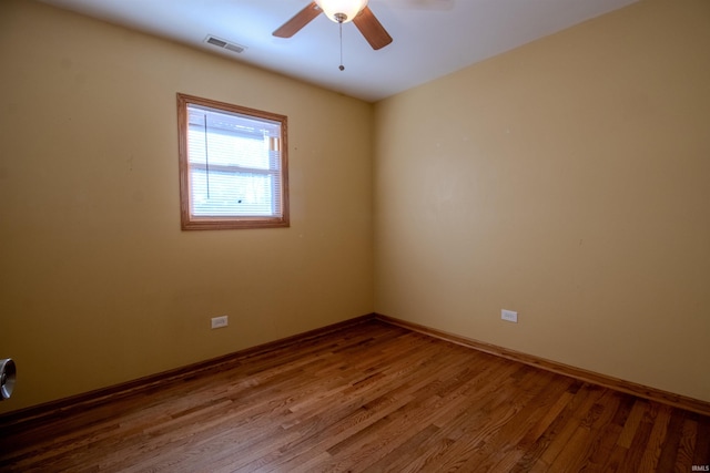 spare room with ceiling fan and hardwood / wood-style floors