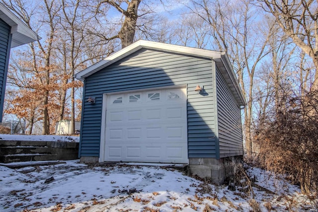 view of snow covered garage