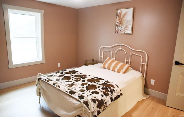 bedroom with light hardwood / wood-style floors