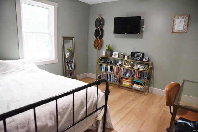 bedroom with wood-type flooring