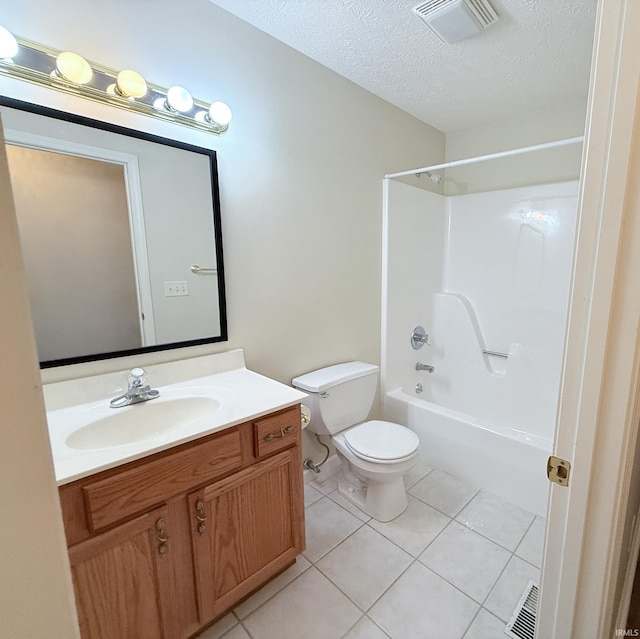 full bathroom featuring toilet, tile patterned floors,  shower combination, a textured ceiling, and vanity