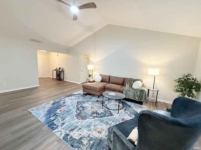 living room featuring ceiling fan, wood-type flooring, and lofted ceiling