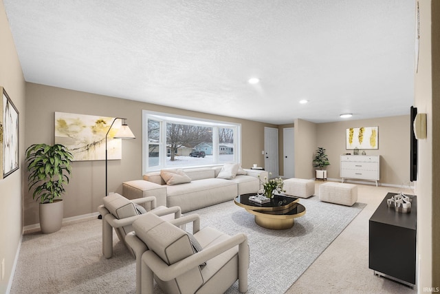 living room with light colored carpet and a textured ceiling