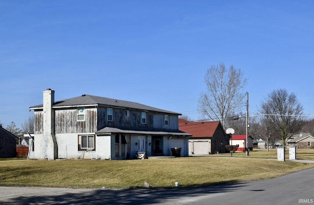 exterior space with a lawn and a garage