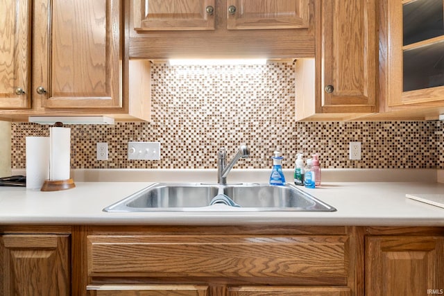 kitchen featuring decorative backsplash and sink