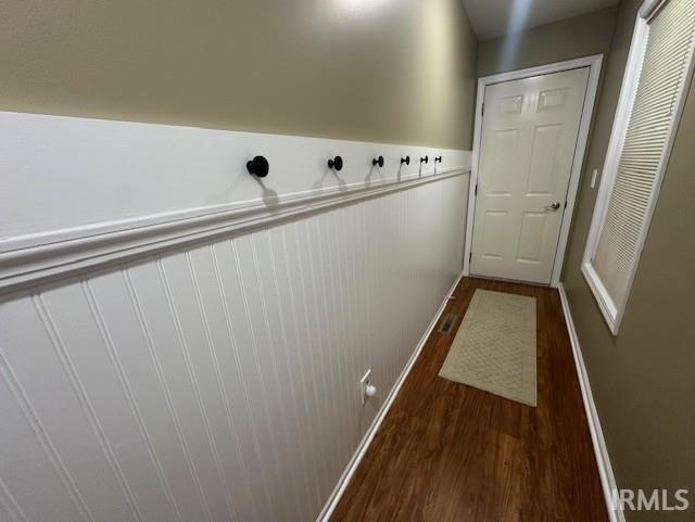 entryway with dark wood-type flooring