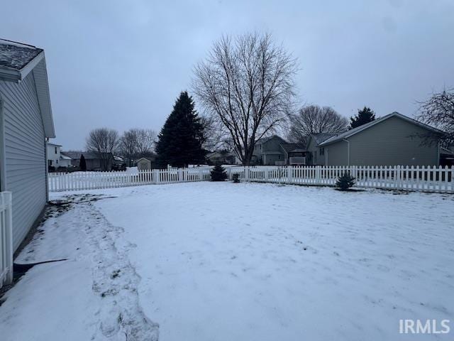 view of yard layered in snow