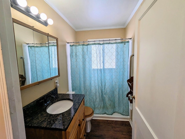 full bathroom featuring toilet, hardwood / wood-style floors, shower / tub combo with curtain, crown molding, and vanity