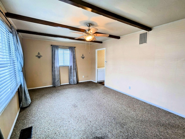 unfurnished room with carpet floors, ceiling fan, and beamed ceiling