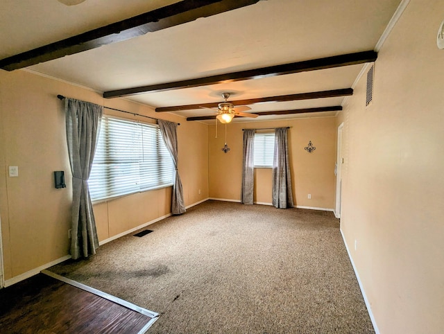 empty room with beam ceiling, ceiling fan, and dark carpet