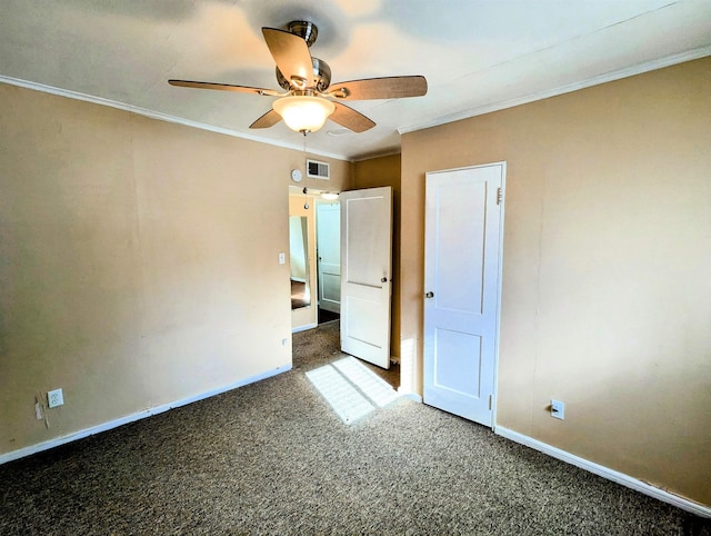 unfurnished bedroom with ceiling fan, dark carpet, and crown molding