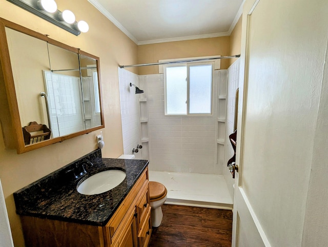 bathroom with walk in shower, vanity, toilet, wood-type flooring, and crown molding