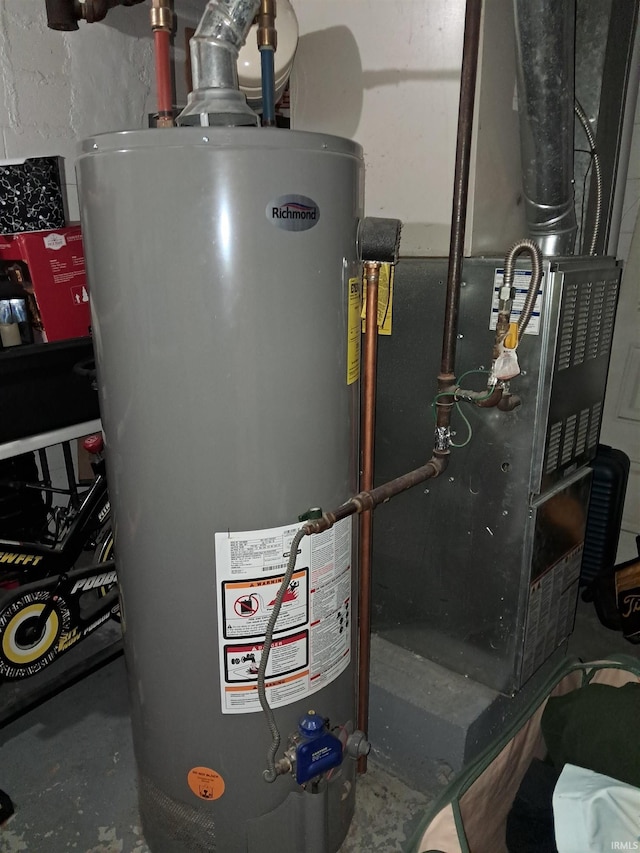 utility room featuring heating unit and water heater