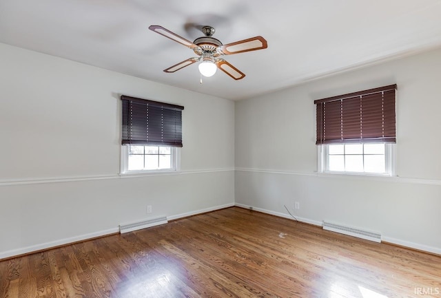 unfurnished room featuring ceiling fan and hardwood / wood-style floors