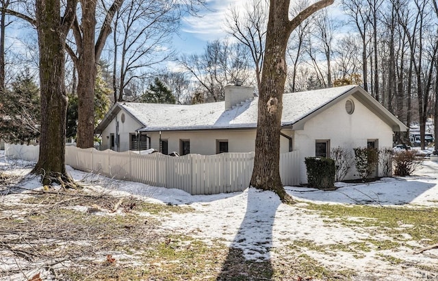 view of snow covered property