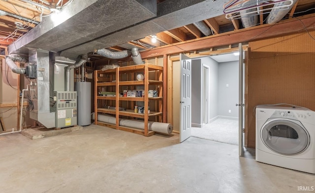 basement with heating unit, gas water heater, and washer / clothes dryer