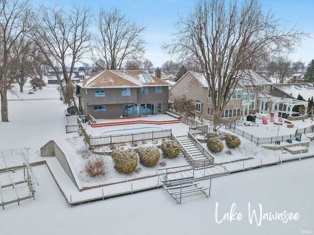 view of snow covered house