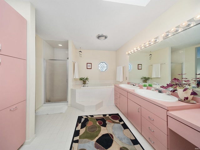 bathroom with tile patterned floors, vanity, and independent shower and bath