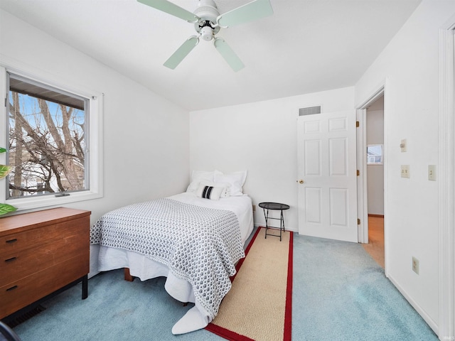 carpeted bedroom featuring ceiling fan