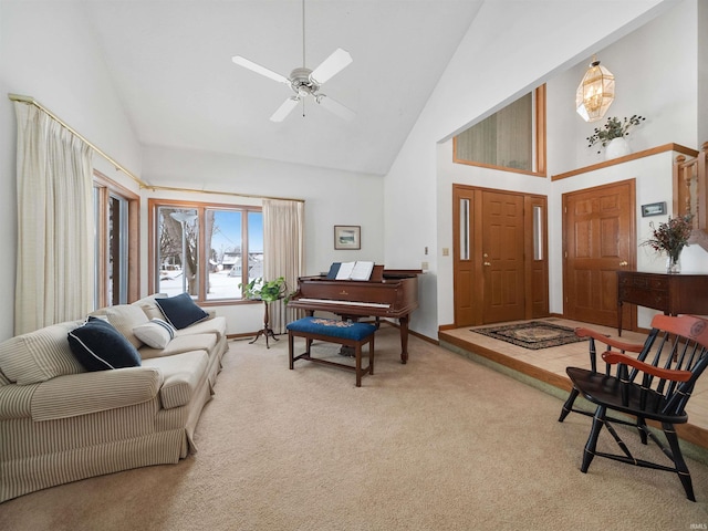 living room with high vaulted ceiling, carpet floors, and ceiling fan