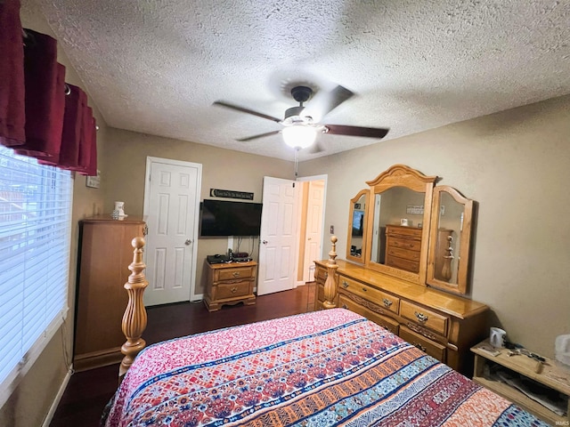 bedroom featuring a textured ceiling and ceiling fan