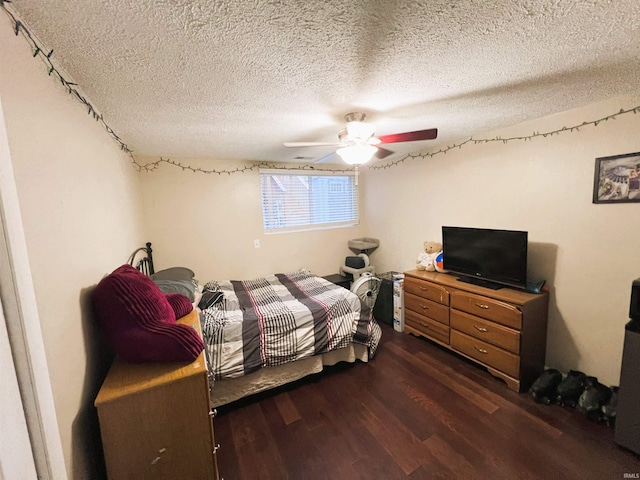 bedroom featuring a textured ceiling, ceiling fan, and dark hardwood / wood-style flooring