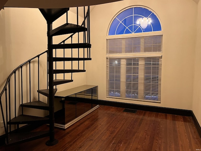 stairs with hardwood / wood-style flooring