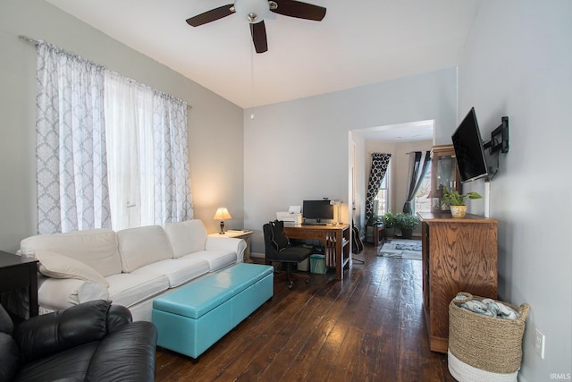 living room with ceiling fan and dark hardwood / wood-style floors