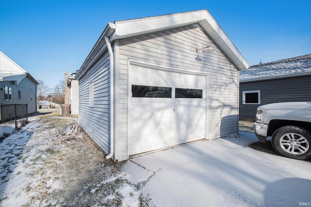 view of snow covered garage