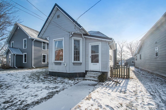 view of snow covered house