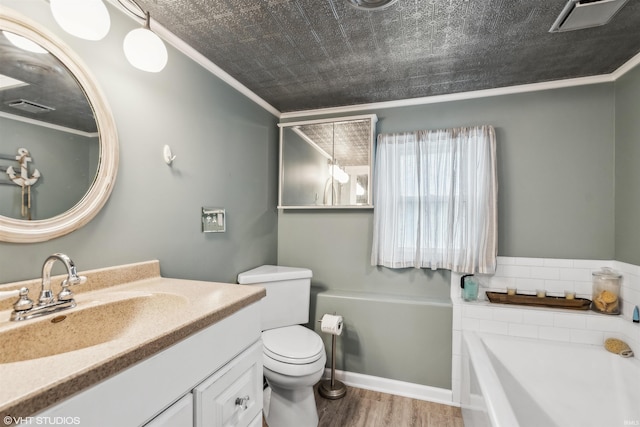 bathroom featuring toilet, a tub to relax in, wood-type flooring, crown molding, and vanity