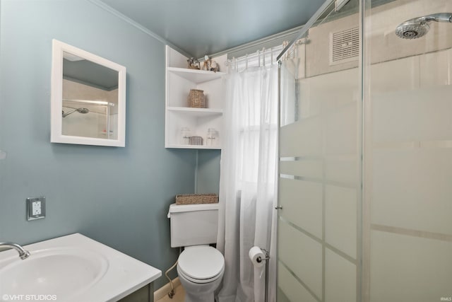 bathroom with toilet, vanity, and a shower