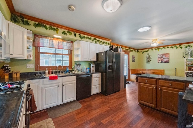 kitchen featuring black appliances, a wealth of natural light, sink, white cabinetry, and dark wood-type flooring