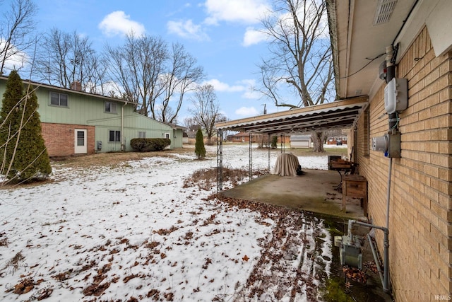 view of yard layered in snow