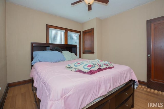 bedroom featuring ceiling fan and light hardwood / wood-style flooring