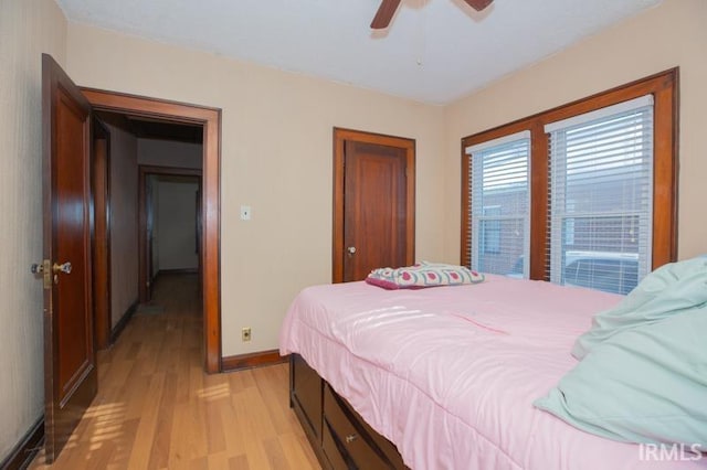 bedroom featuring ceiling fan and light hardwood / wood-style floors