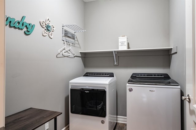 clothes washing area featuring independent washer and dryer